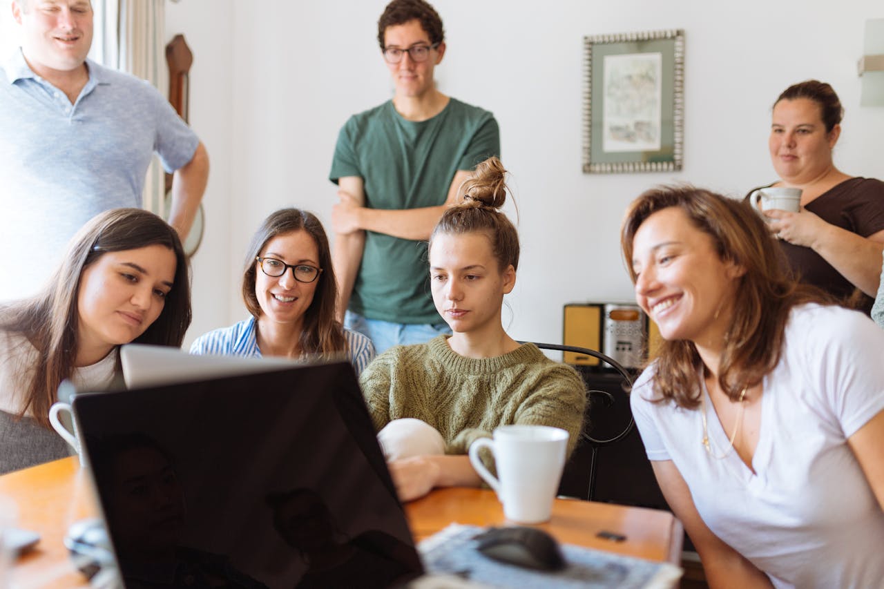 People Looking at Laptop and Computer 